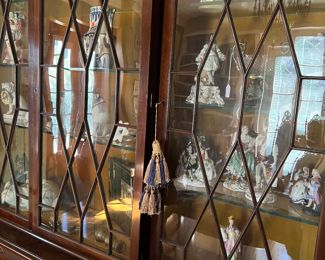 Probably Baker...Large Display case    Many porcelain figures