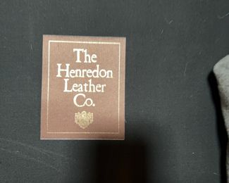 This is on the large brown leather coach so we believe the Henredon Co did the leather...either Baker or Henredon are both very high end and high quality
