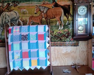 Bedroom dresser, quilt rack with patchwork quilt, horse tapestry, wall pendulum clock