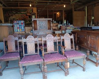 Vintage Eastlake style oak dining set with table, six chairs, tall breakfront, and buffet.  