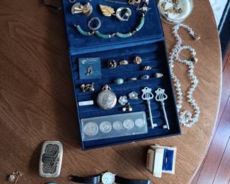 Sample of a wide collection of jewelry:  Embassy pocket watch; Seiko wristwatch, Kwai piano keys; selection of rings, necklaces.  