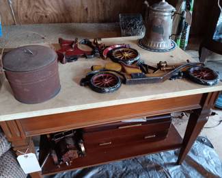 Marble topped end table; cast iron car wall hangings; antique coffee pot; 