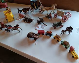  Motorcycle with sidecar and figures; Cannon; Horse and buggy; Roy Rogers Jeep with Roy; Hubley AC Williams Stake truck; Hubley Fire Truck with Horses; Steam engine; Buggy with lady and horses; Vintage wooden circus cars with animals; 
