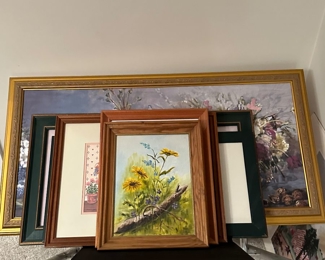 Many Framed Pieces of Art