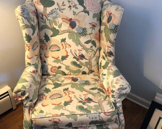 Wing back chair with unusual custom floral/bird upholstery.