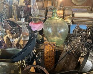 Old demijohn bottle, antique cash registers in back