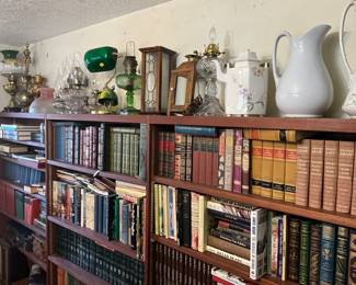 Hurricane lamps, pitchers, books