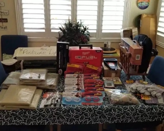 Many items available, including 30" picture lights, (in an antique gold finish or pewter finish). Plastic tablecloths, round and rectangle, vintage magazine rack, work gloves, pots, plants, etc.