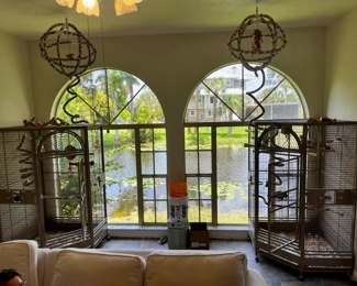 Corner bird cages on casters (2)- Door width 25"; sides 22"; cornerside 40"; corner to front 42"; 72" tall