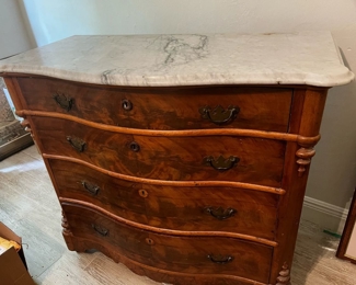 1900s Marble top Crotch Mahagony wheeled 4 drawer dresser