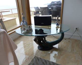 Mermaid base oval glass top cocktail table