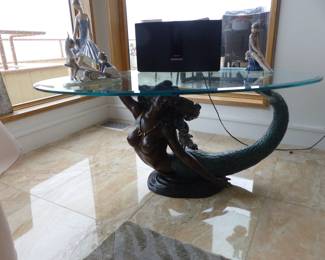 Mermaid base oval glass top cocktail table