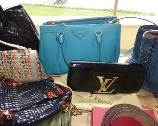 Designer Prada and Louis Vuitton handbags
