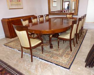 Large dining table with 10 chairs, sideboard, area rug