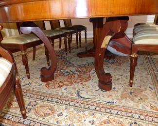 Large dining table with 10 chairs, sideboard, area rug