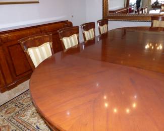 Large dining table with 10 chairs, sideboard, area rug
