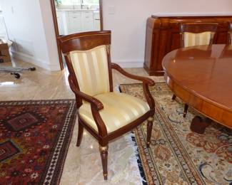 Large dining table with 10 chairs, sideboard, area rug