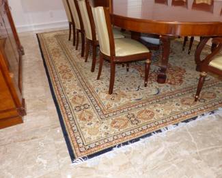 Large dining table with 10 chairs, sideboard, area rug