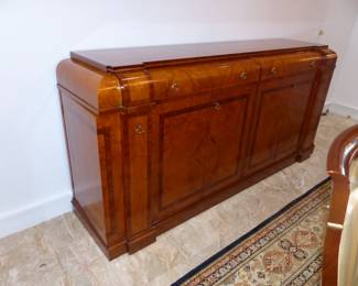 Large dining table with 10 chairs, sideboard, area rug