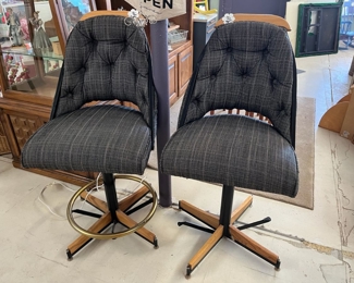 A pair of padded stools