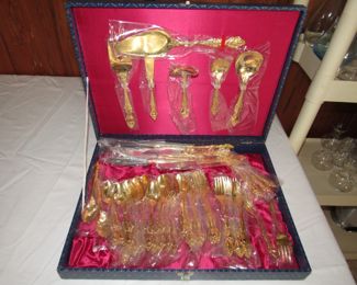 Vintage gold-plated flatware set never used