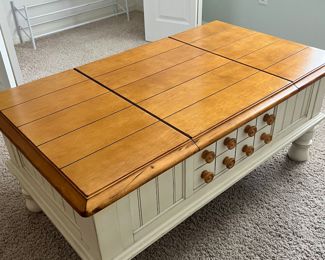 Coffee table with 2 sides that lift for storage $195