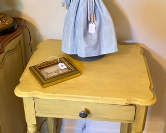 Table and antique doll