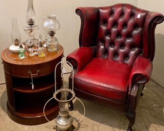 Red leather chair, round table, assorted kersoene lamps