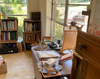 Barley twist table, pine hooster cabinets with lots of books of all kinds, some vintage