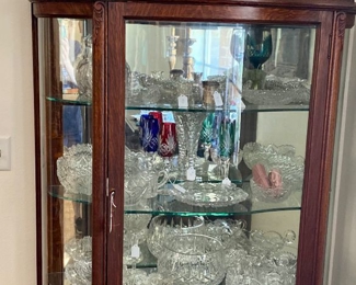 Curio cabinet with bronze mid century art pieces and chrystal