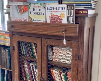 Pine hooster cabinet with books of all kinds, cookbook, vintage books and magazines