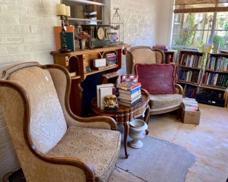 Wing back chairs, burl tray/coffee table, books and magazines.