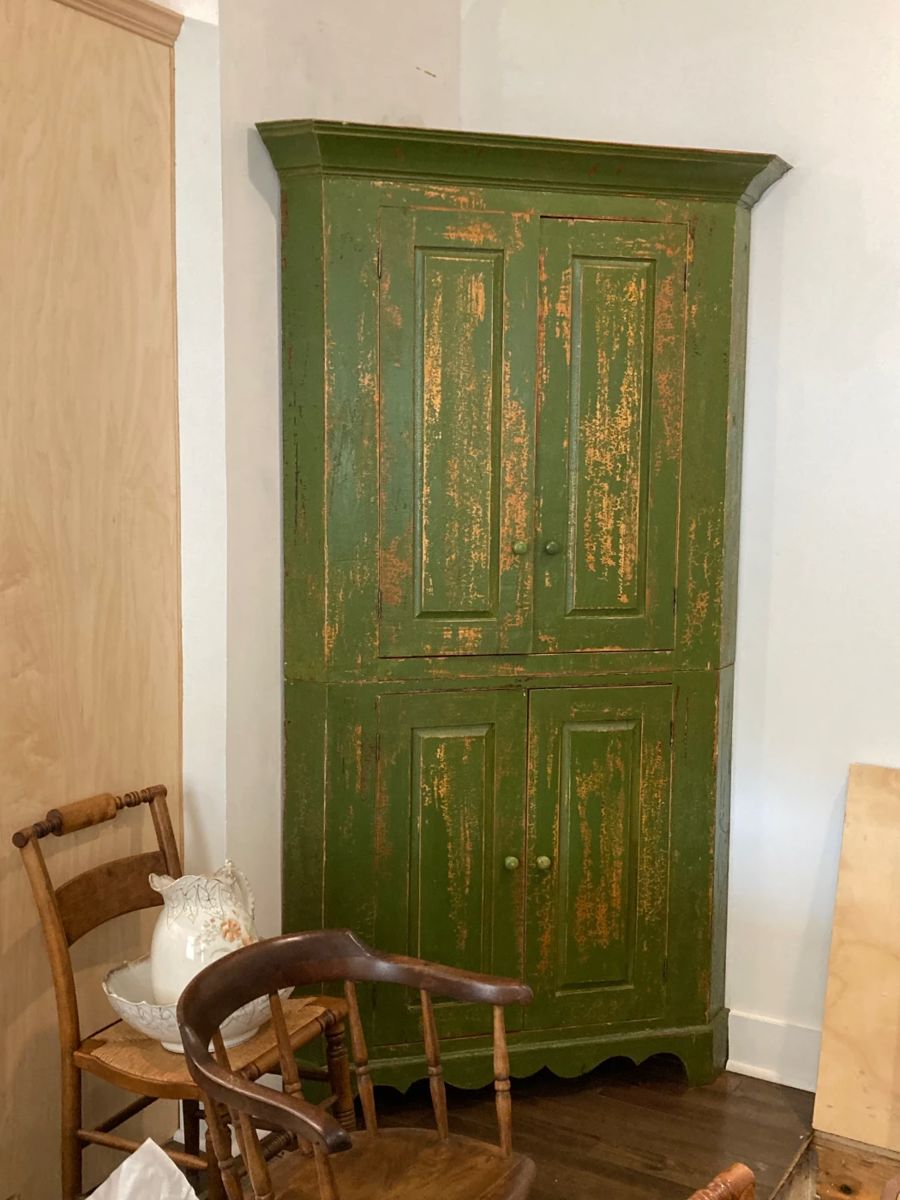 beautiful corner cabinet with well patina'd green paint