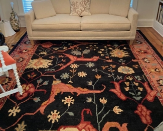 gorgeous rug in the library,  and very nice white sofa
