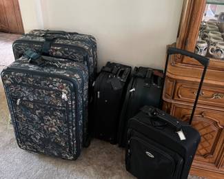 The two smaller suitcases are still available.