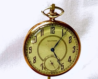 DONLAR915 Antique 14K Gold Waltham Pocket Watch: Working 14K gold open face antique pocket watch, marked 19 jewels.  Approximate weight 57 grams.  Case serial #460839.  Includes stand with wooden base.
