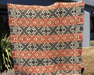 JIFI105 Signed 1862 Adam Yearous Woven Coverlet Blanket: This is an antique signed and dated Knox County, Ohio. Americana handwoven coverlet, made by Adam Yearous in 1862. (B. 1827 D. 1875) Colors are brick red, dark blue with off white, background. It depicts, star bursts, tulips and buildings.&nbsp;
