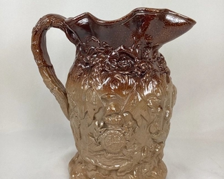 JIFI111 1840 Stephen Green Lambeth Pottery Jug: This is an antique Stephen Green Lambeth pottery jug, made to commemorate the marriage of Queen Victoria and Prince Albert in 1840. This piece of imperial pottery is from England, and features a molded&nbsp;profile relief of Queen Victoria and Prince Albert, as well as a royal crest and other imagery.&nbsp;
