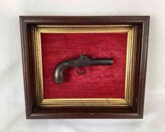 JIFI112 1850-1875 Derringer Style Firearm: This is a framed and mounted 1850-1875 derringer style blackpowder firearm pistol. This personal defense pistol features a beautiful, professionally made Damascus steel pattern on the barrel. The manufacturer is unknown, but it is stamped with either A9, L9, or I9.&nbsp;

