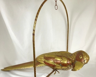 JIFI117 Brass Bustamante Parrot #1 : This is a large brass Bustamante parrot hanging sculpture. It features beautifully handshaped feathers and glass eyes.&nbsp;

