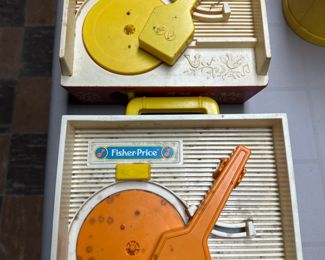Fisher Price Record Players and one even has the DISCS!