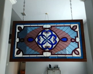 Stained glass  very heavy . I didn't measure but looks maybe 4ft X 30in 