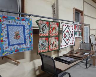 many completed quilts of all sizes and designs