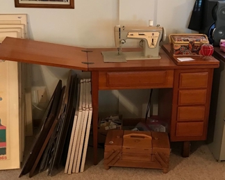 Nice vintage Singer Sewing machine and cabinet. This is one of the good metal ones before plastic!!! It works - Kathy tried it out. Sewing baskets and supplies.