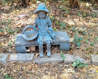 Girl on bench garden statue