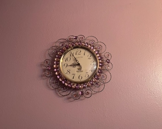 small, ornate wall clock