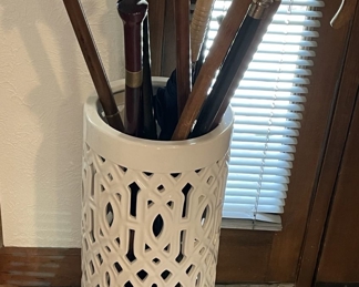 Unbrella stand full of great canes.