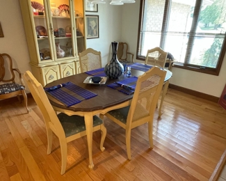 Table with 4 chairs and hutch.