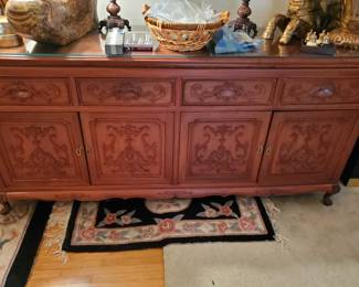 Beautiful! Asian Influence with Brass. Has glass across the top to protect the top. Deep Shelves and wonderful, top drawers.