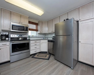 Second floor unit kitchen includes a generous pantry. Fridge mfg. 11/2019